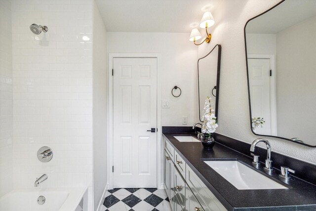 full bath featuring a sink, shower / tub combination, and double vanity