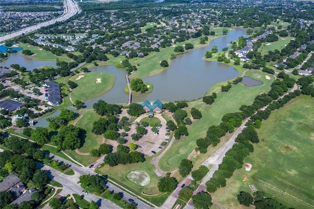 aerial view featuring a water view and golf course view