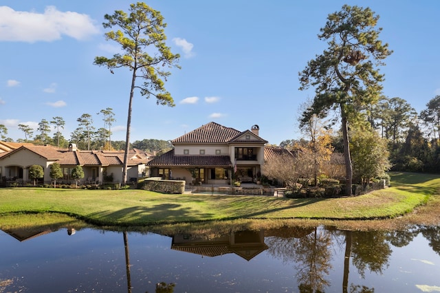 3034 Serena Vista Way, Houston, TX 77068 - back of property featuring a tiled roof, a water view, a yard, and a chimney