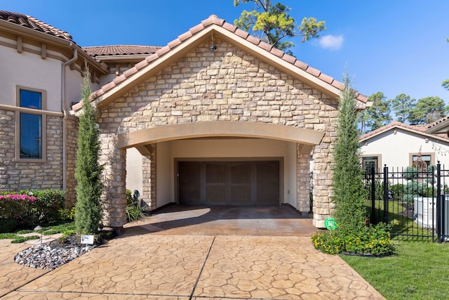 3034 Serena Vista Way, Houston, TX 77068 - view of front facade with driveway, stone siding, fence, and an attached garage