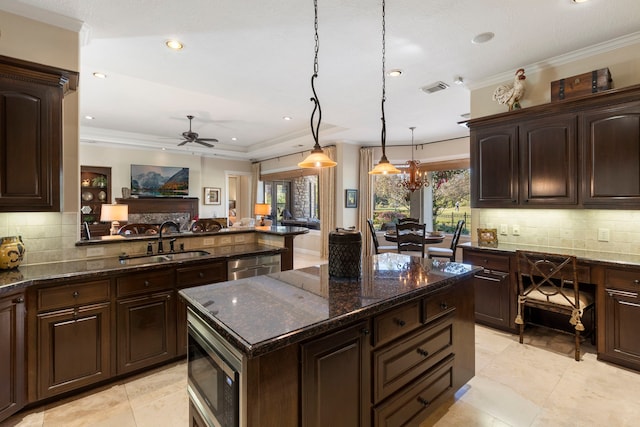 3034 Serena Vista Way, Houston, TX 77068 - kitchen featuring a sink, appliances with stainless steel finishes, ceiling fan, decorative backsplash, and open floor plan
