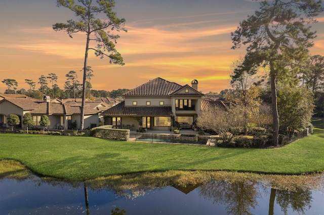 3034 Serena Vista Way, Houston, TX 77068 - back of property featuring a tile roof, a chimney, a lawn, and a water view