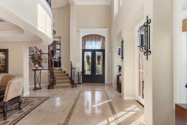 3034 Serena Vista Way, Houston, TX 77068 - entrance foyer featuring a towering ceiling, inlaid floor details, baseboards, crown molding, and stairway