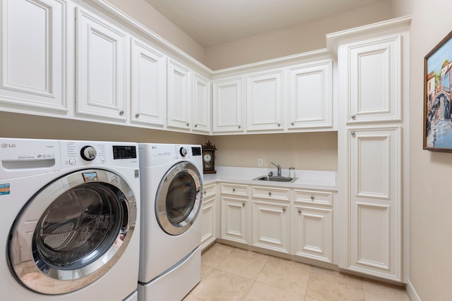 3034 Serena Vista Way, Houston, TX 77068 - washroom featuring independent washer and dryer, cabinet space, and light tile patterned floors