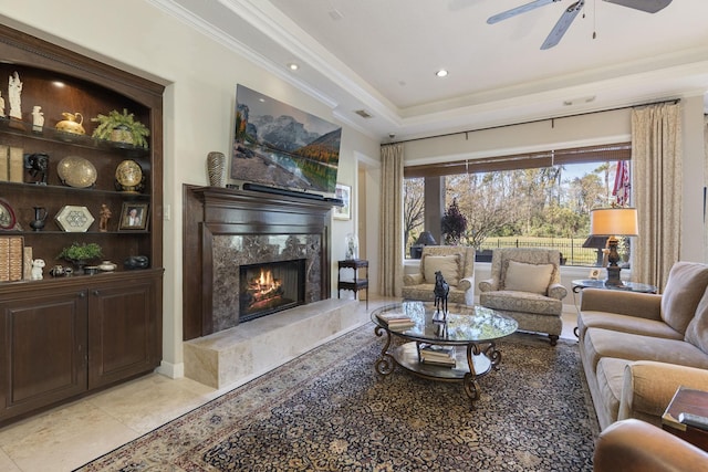 3034 Serena Vista Way, Houston, TX 77068 - living area with ceiling fan, a high end fireplace, crown molding, and a raised ceiling