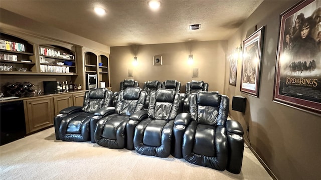 3034 Serena Vista Way, Houston, TX 77068 - home theater room with carpet, a textured ceiling, and bar area