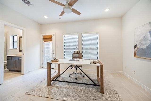 office space with baseboards, ceiling fan, recessed lighting, and visible vents