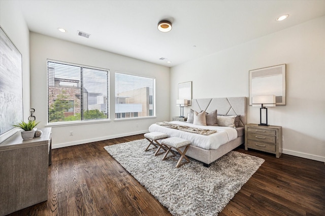 bedroom with baseboards, recessed lighting, dark wood-style floors, and visible vents