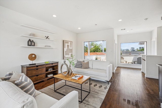 living room featuring recessed lighting, baseboards, visible vents, and dark wood-style floors