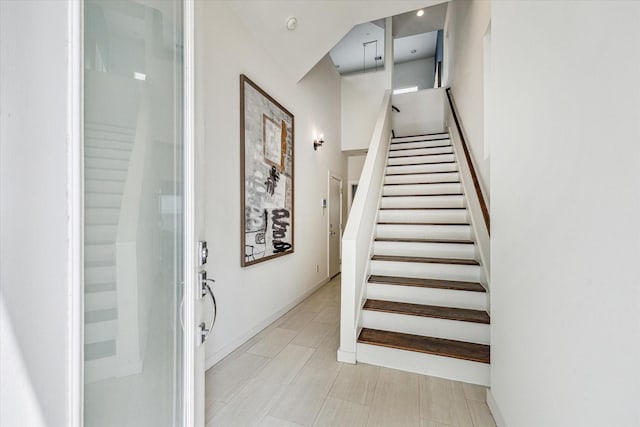 stairway featuring baseboards