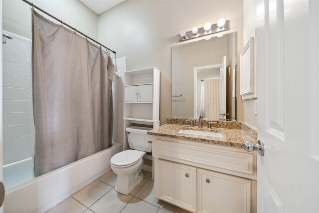 full bathroom featuring vanity, tile patterned flooring, shower / bath combo with shower curtain, and toilet