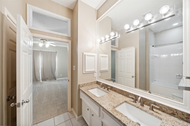 full bath featuring tile patterned flooring, a sink, a ceiling fan, and double vanity