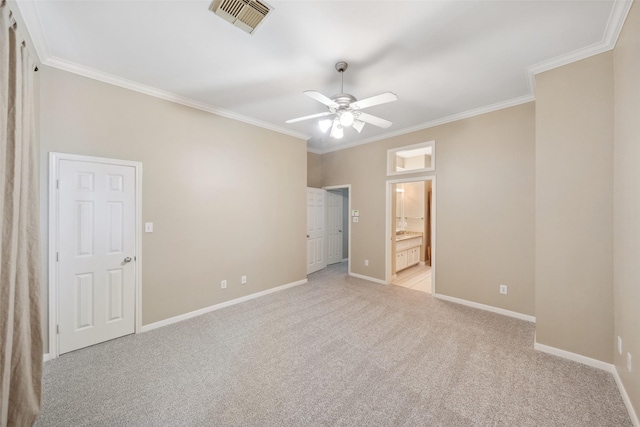 unfurnished bedroom with visible vents, baseboards, crown molding, and light carpet