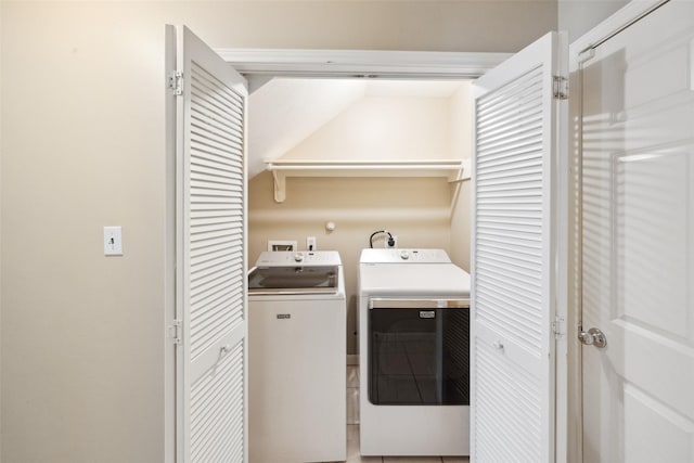 laundry area featuring washer and dryer and laundry area