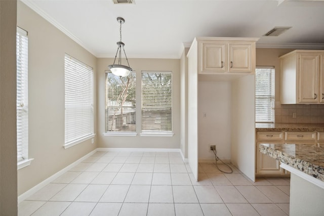 unfurnished dining area with crown molding, visible vents, and light tile patterned floors