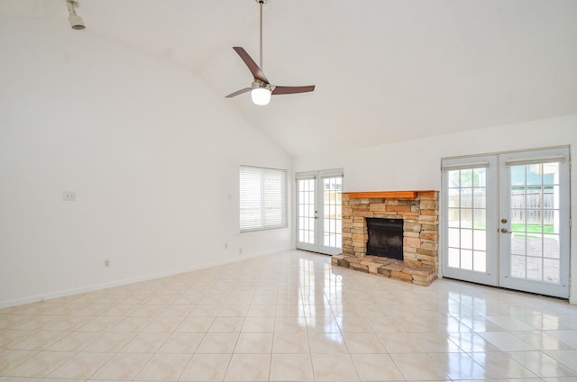 unfurnished living room featuring french doors, plenty of natural light, high vaulted ceiling, and ceiling fan
