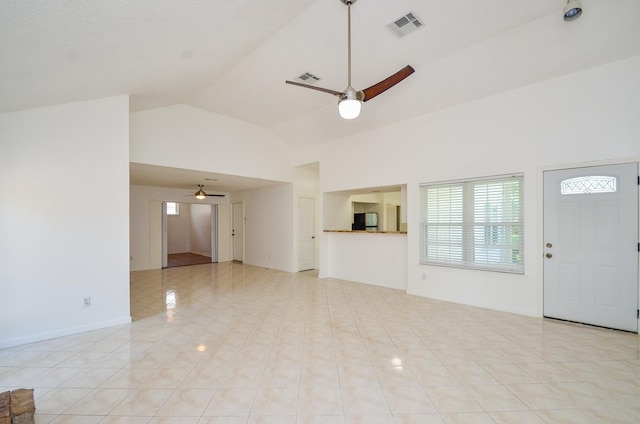 unfurnished living room with a ceiling fan, high vaulted ceiling, visible vents, and light tile patterned flooring