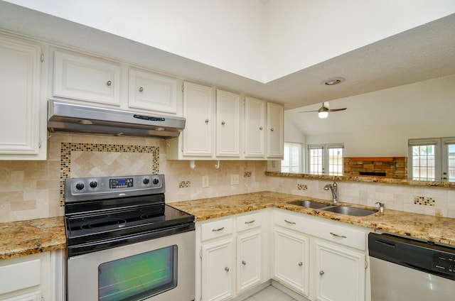 kitchen featuring ceiling fan, appliances with stainless steel finishes, a sink, decorative backsplash, and under cabinet range hood