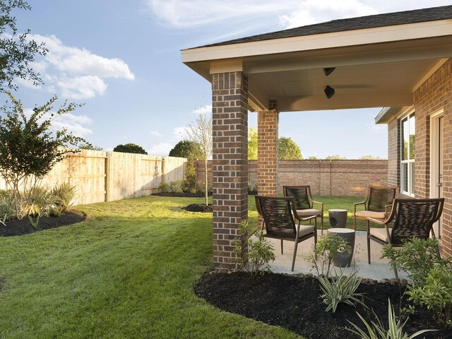 12130 Meandering Stream Dr, Baytown, TX 77523 - view of yard featuring a fenced backyard and a patio