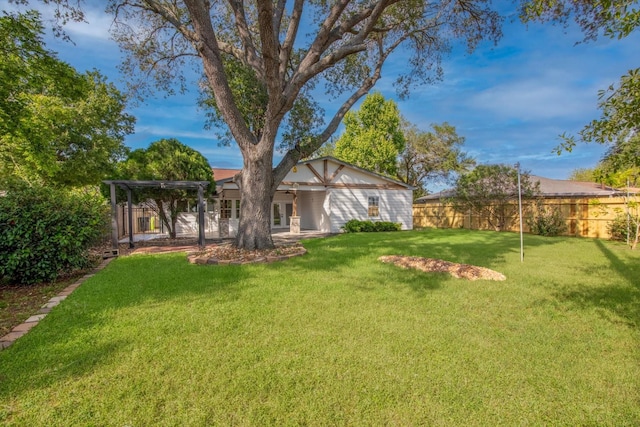 view of yard featuring a fenced backyard, a pergola, and french doors