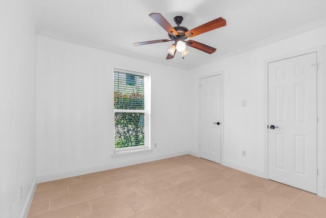 unfurnished bedroom featuring crown molding, baseboards, and ceiling fan