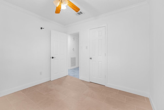 unfurnished bedroom with crown molding, ceiling fan, visible vents, and baseboards