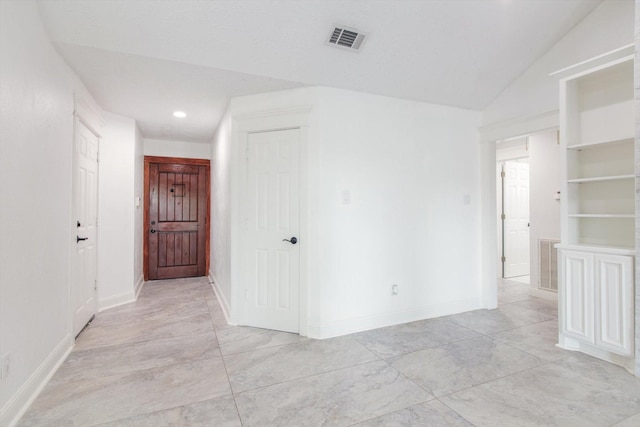 spare room featuring baseboards, recessed lighting, and visible vents