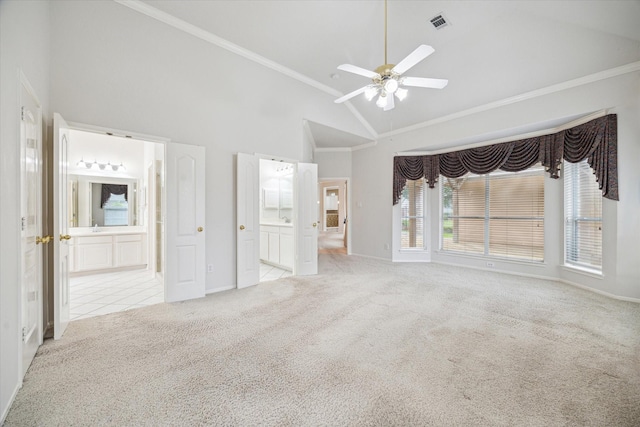 unfurnished bedroom with baseboards, carpet flooring, connected bathroom, and ornamental molding
