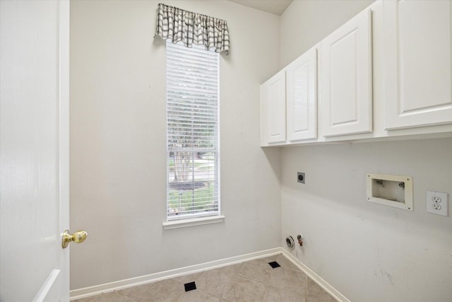 washroom featuring cabinet space, hookup for a washing machine, gas dryer hookup, electric dryer hookup, and baseboards