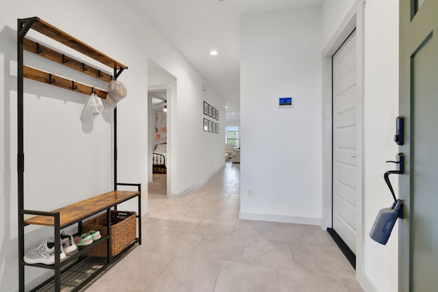 29823 Case Canyon Ln, Katy, TX 77494 - hall with light tile patterned floors, baseboards, and recessed lighting