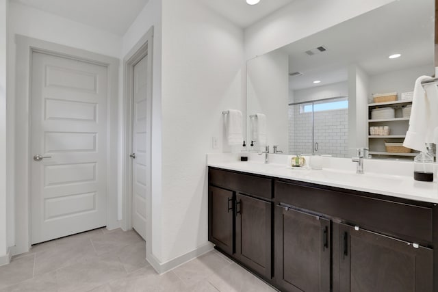 29823 Case Canyon Ln, Katy, TX 77494 - full bathroom featuring double vanity, visible vents, a shower stall, a sink, and baseboards