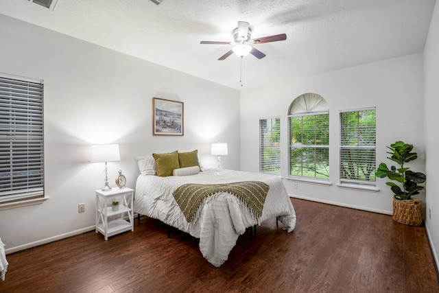 bedroom featuring baseboards, a ceiling fan, and wood finished floors
