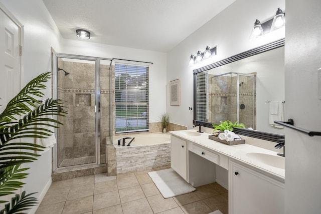 bathroom featuring a sink, tile patterned flooring, a shower stall, and a bath