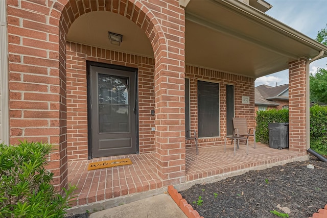 10834 Glenora Dr, Houston, TX 77065 - doorway to property with covered porch and brick siding