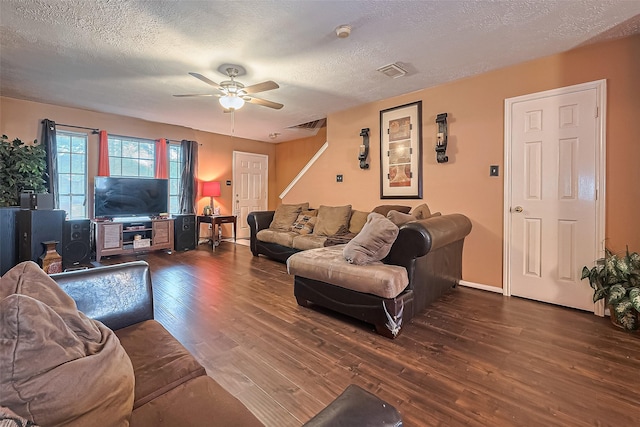 10834 Glenora Dr, Houston, TX 77065 - living area featuring a textured ceiling, ceiling fan, wood finished floors, and visible vents