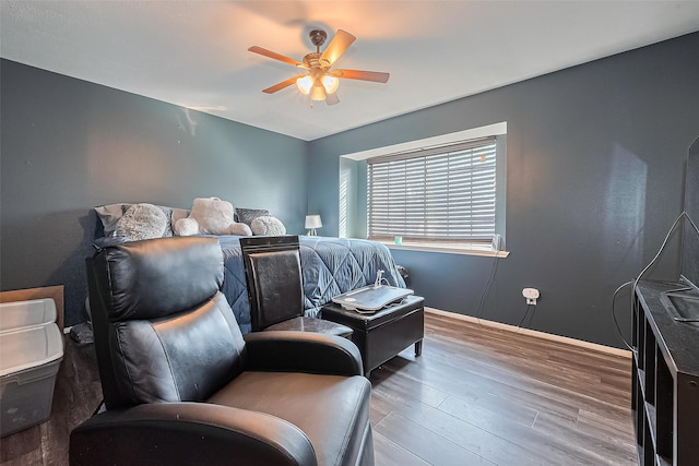 10834 Glenora Dr, Houston, TX 77065 - bedroom featuring baseboards, ceiling fan, and wood finished floors