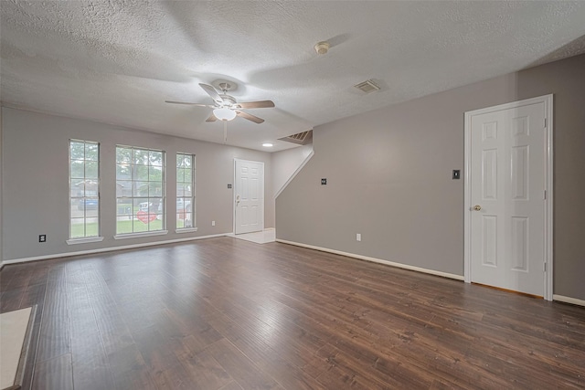 10834 Glenora Dr, Houston, TX 77065 - unfurnished living room with a ceiling fan, dark wood finished floors, and a textured ceiling