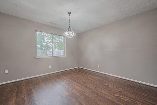 10834 Glenora Dr, Houston, TX 77065 - empty room with a chandelier and dark wood-style flooring
