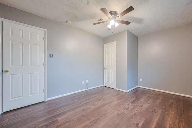 10834 Glenora Dr, Houston, TX 77065 - empty room with a textured ceiling, a ceiling fan, wood finished floors, and a smoke detector