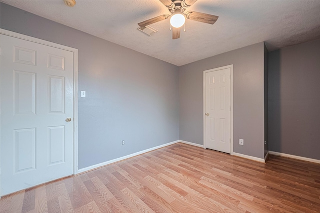 10834 Glenora Dr, Houston, TX 77065 - unfurnished room with a ceiling fan, light wood-type flooring, and a textured ceiling