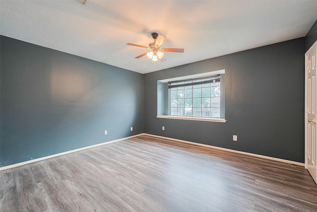 10834 Glenora Dr, Houston, TX 77065 - spare room with ceiling fan and wood finished floors
