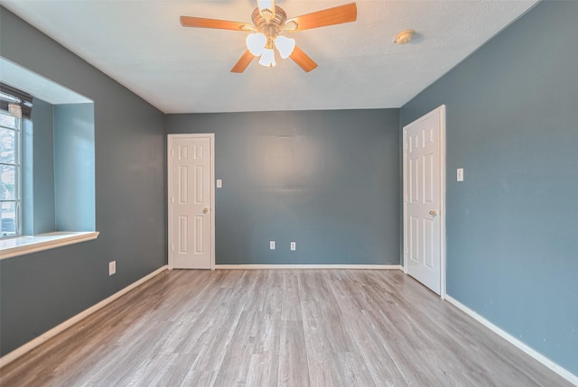 10834 Glenora Dr, Houston, TX 77065 - unfurnished room featuring wood finished floors, ceiling fan, and a smoke detector