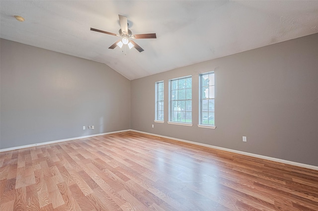 10834 Glenora Dr, Houston, TX 77065 - unfurnished room featuring light wood-type flooring, ceiling fan, vaulted ceiling, and a smoke detector