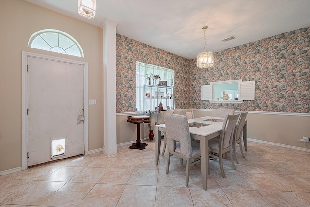 dining room featuring baseboards, visible vents, wallpapered walls, and tile patterned floors