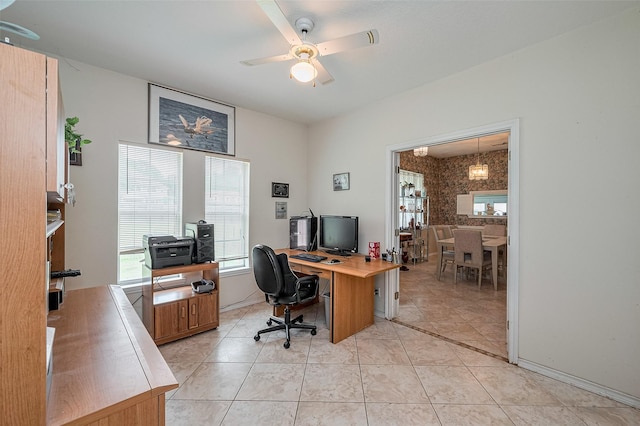 home office with ceiling fan and light tile patterned floors