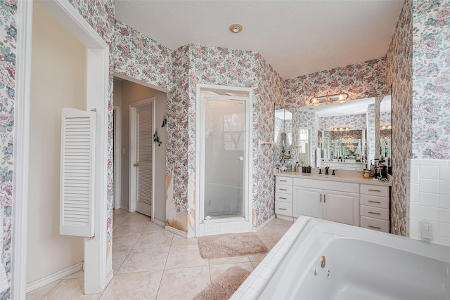 bathroom featuring baseboards, a jetted tub, wallpapered walls, tile patterned floors, and a stall shower