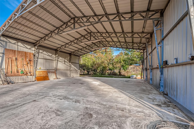 exterior space with a detached carport and driveway