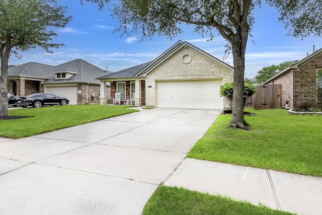 view of front of property featuring an attached garage, a front lawn, brick siding, stone siding, and concrete driveway