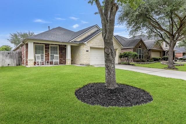ranch-style house featuring an attached garage, a front lawn, fence, and driveway