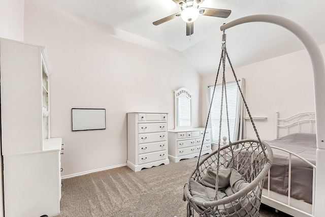 bedroom featuring carpet floors, baseboards, vaulted ceiling, and ceiling fan